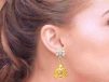 Floral Design Gold Embossed Jhumka Earrings With CZ